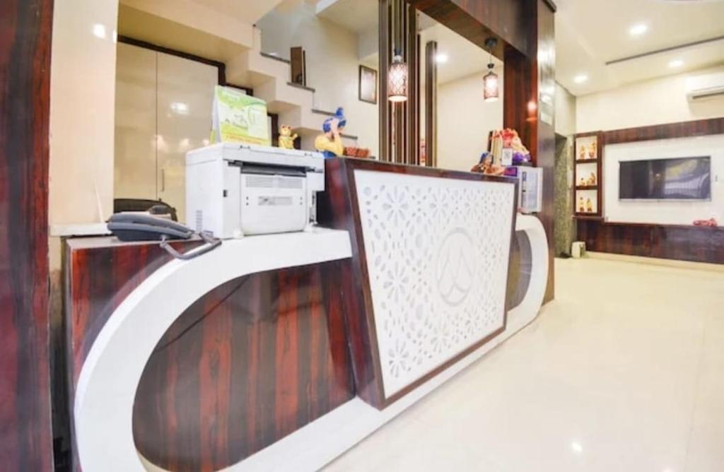 a store with a counter with a microwave on it at Hotel West Guest House in Gangtok