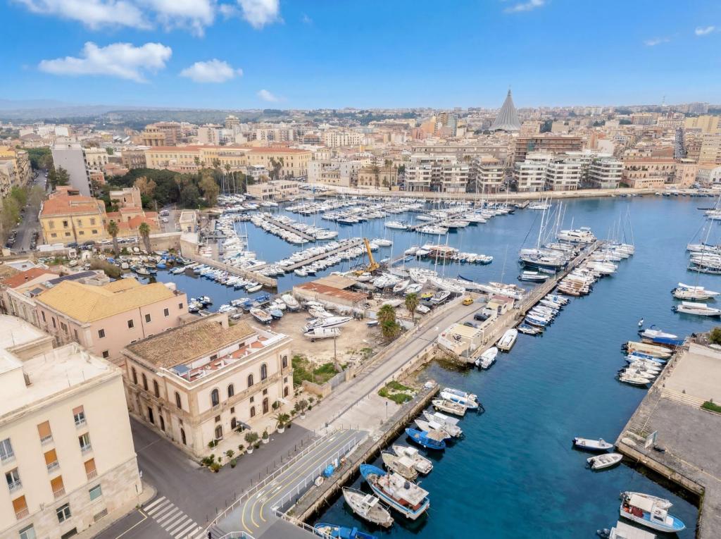 an aerial view of a harbor with boats at La Finestra sul Mare di Ortigia Suite Luxury in Syracuse