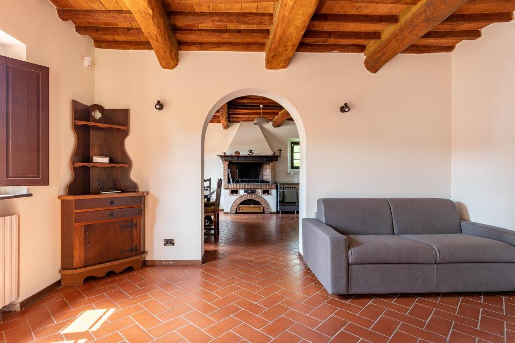 a living room with a couch and a fireplace at La Casina di Elisa in Montecarlo