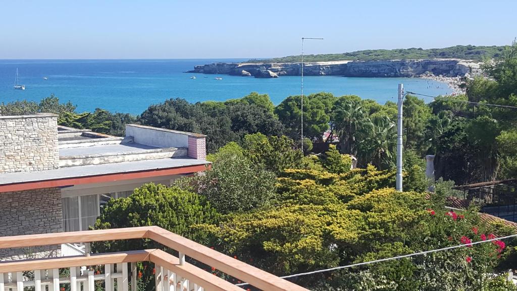 a balcony of a house with a view of the ocean at Torre dell'orso centralissima vista mare in Torre dell'Orso