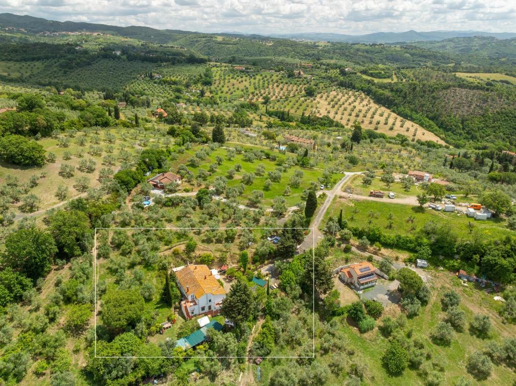 an aerial view of a farm with a house at Agriturismo Il Badalo in Riparbella