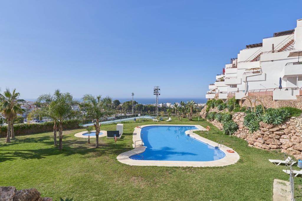 an image of a swimming pool in front of a building at Paraíso Azul in Nerja