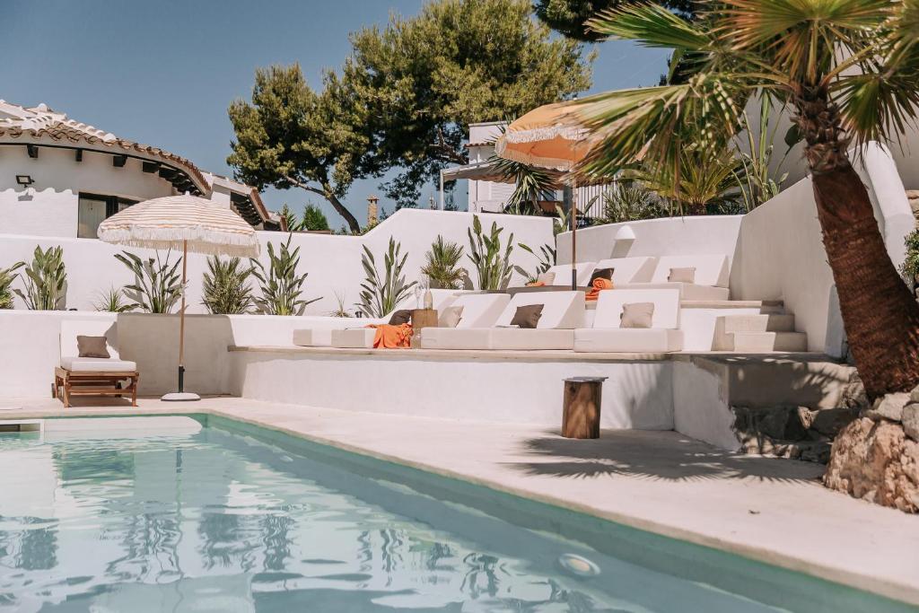 a villa with a swimming pool and a resort at The June Boutique in Benissa