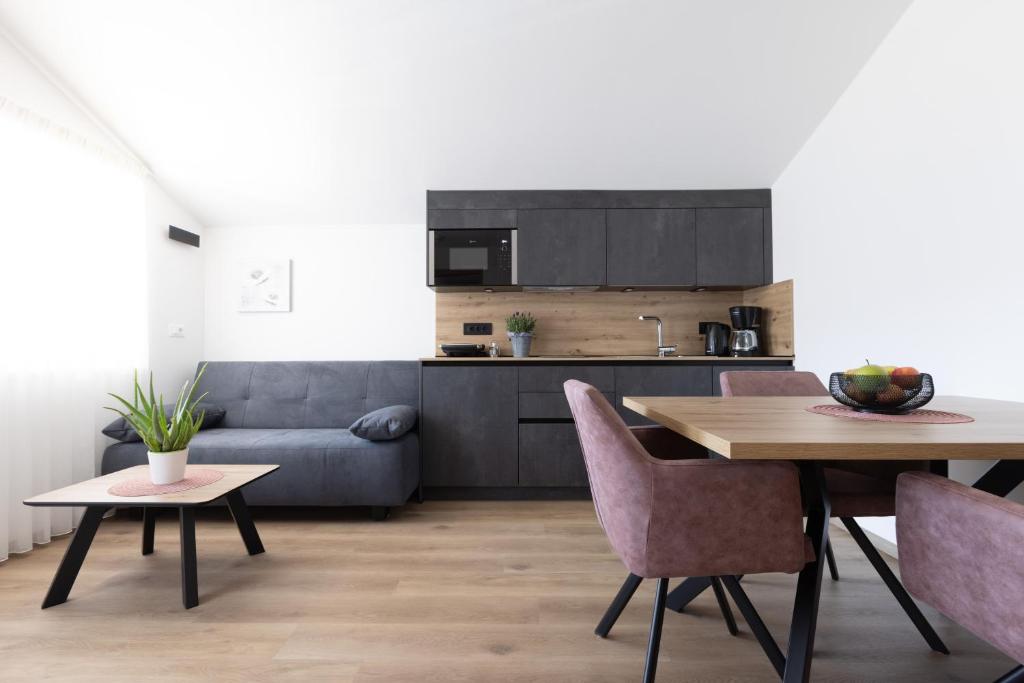 a living room with a table and a couch at Kleon 1 in Rifiano