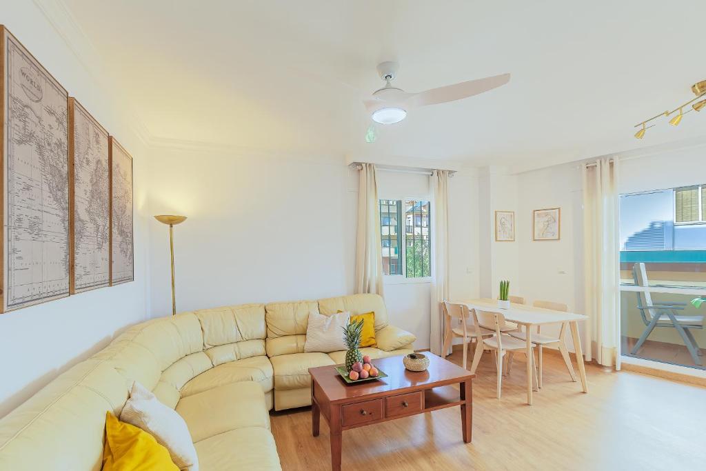 a living room with a couch and a table at A222 El Recreo in Torrox