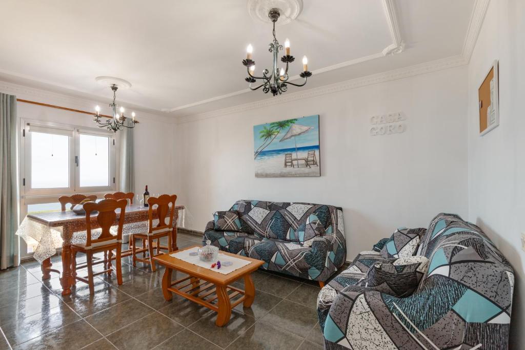 a living room with a couch and a table at Casa Goro in Tazacorte