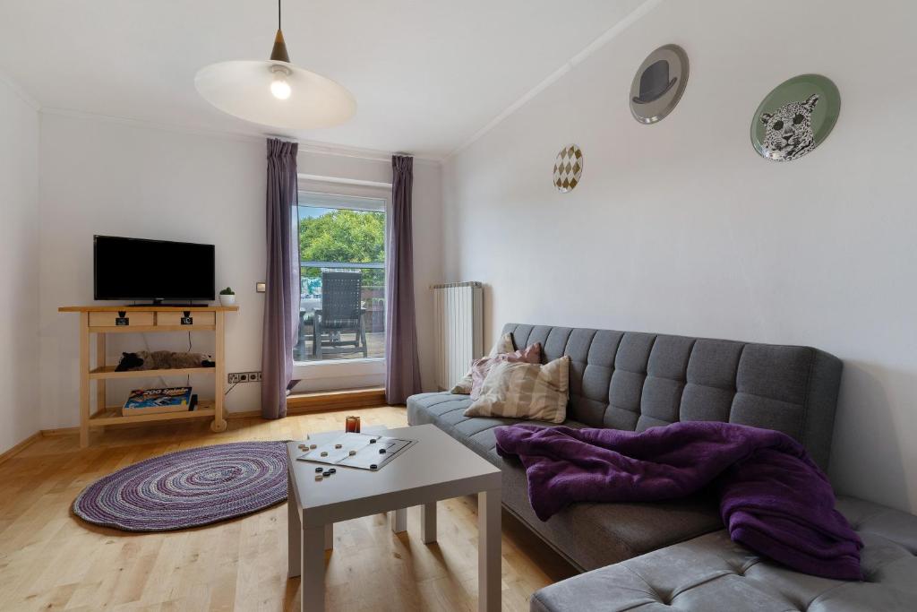 a living room with a couch and a table at Fewo Naturliebe - keine Monteure in Dornhan