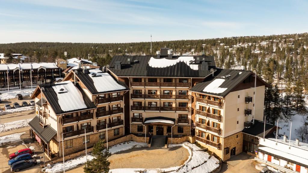 an aerial view of a building with snow covered roofs at Santa's Hotel Tunturi in Saariselka