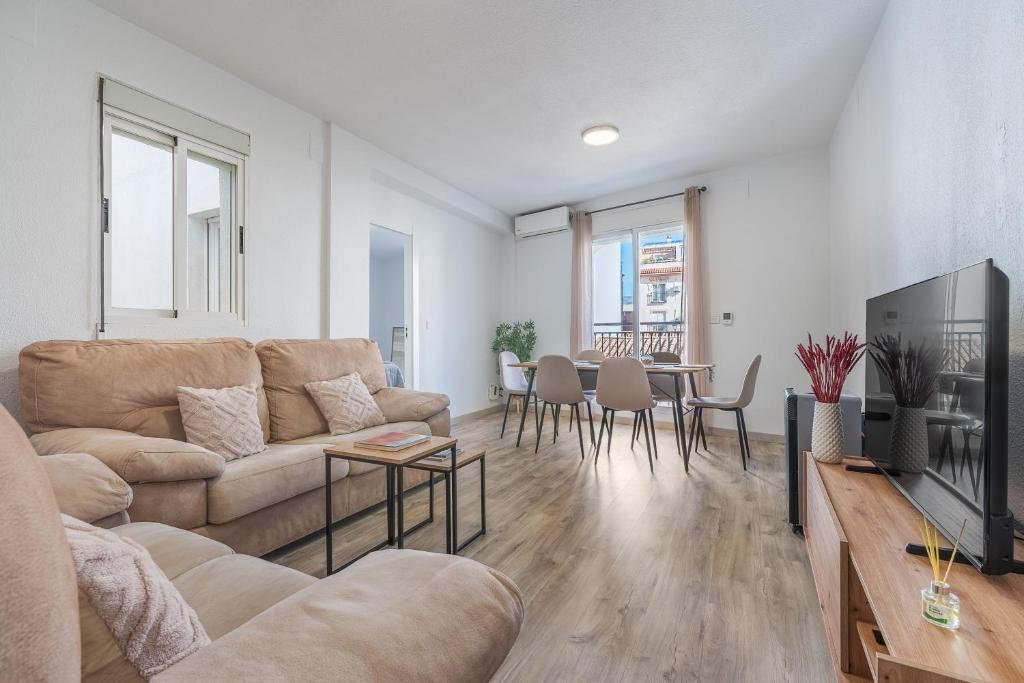 a living room with a couch and a table at Bright Apartment In Maracena in Granada