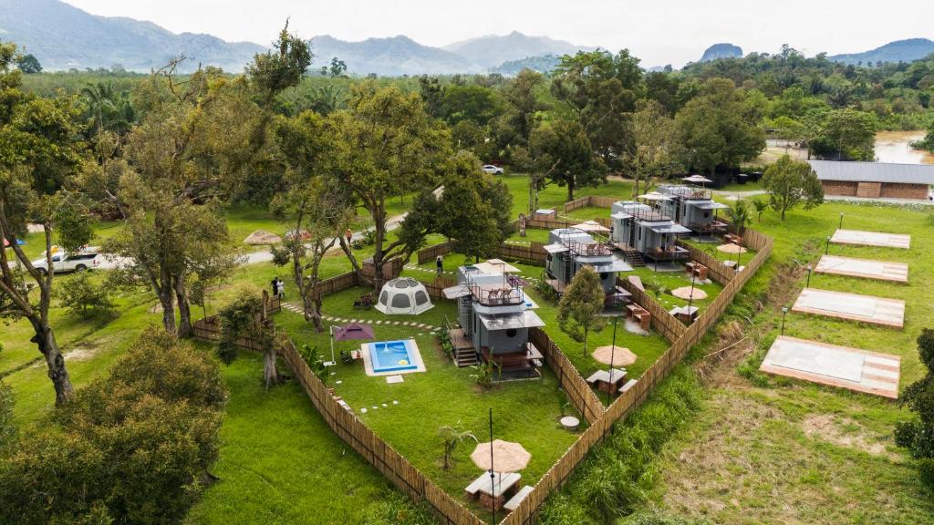 an aerial view of an rv park with tents and umbrellas at Suka Camping - Bentong in Bentong