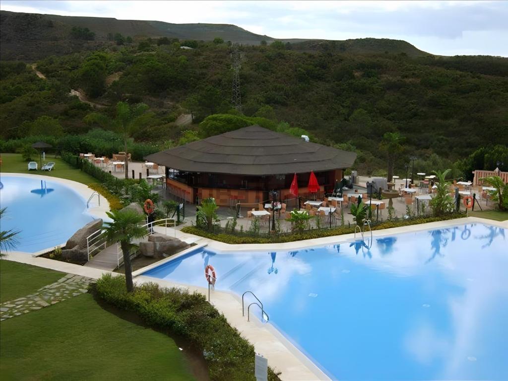an aerial view of a resort with two swimming pools at Luxury 3 Beds Villa Inside Resort in Estepona
