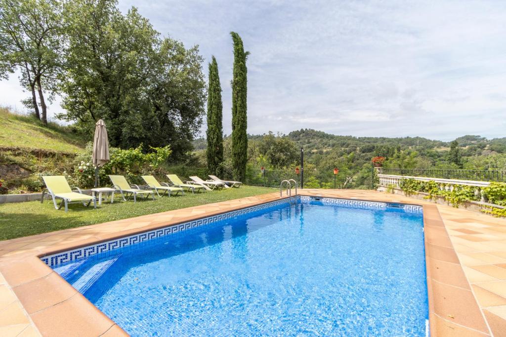 a swimming pool in the backyard of a villa at Casa La Granja in Olvan