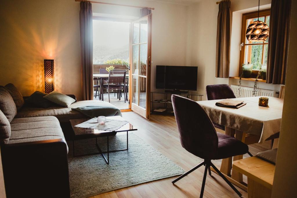 a living room with a couch and a table at Apartment Andreas - Gallhof in Vollan