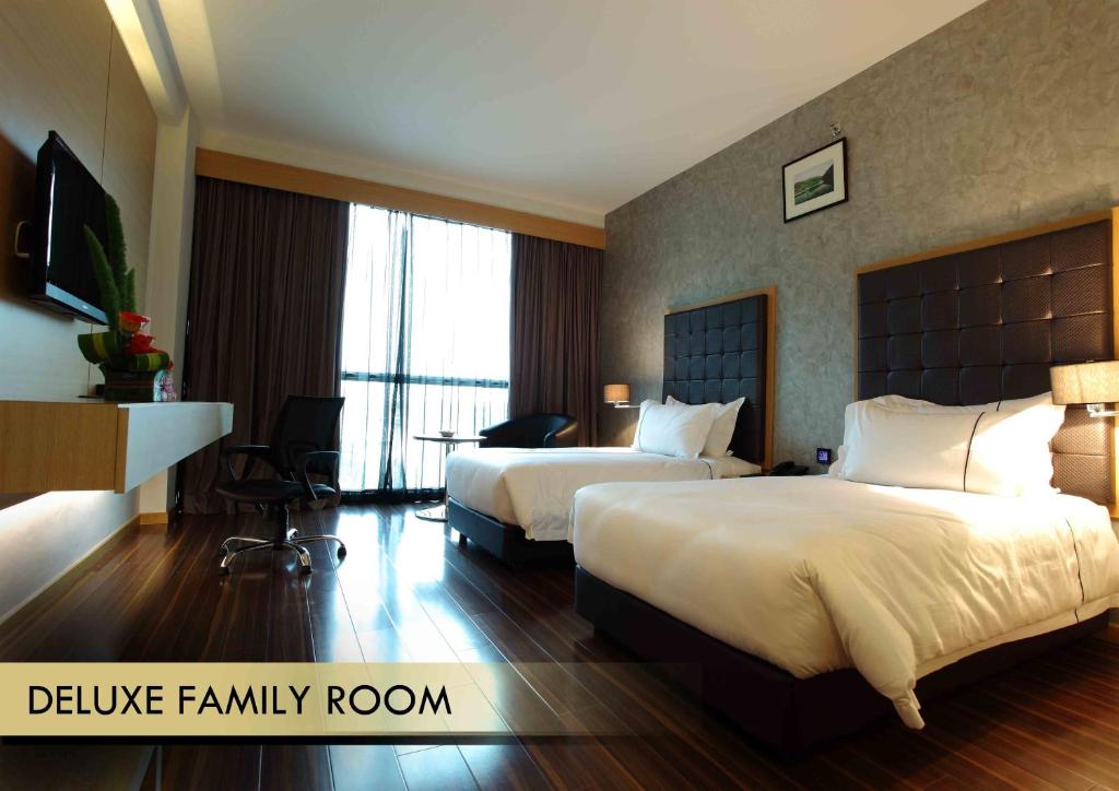 Letto o letti in una camera di Symphony Suites Hotel