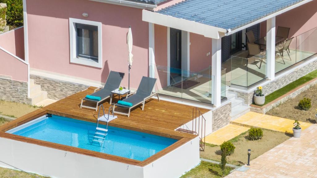 an aerial view of a house with a swimming pool at Sonny 2 Bedroom House in Koukounariá