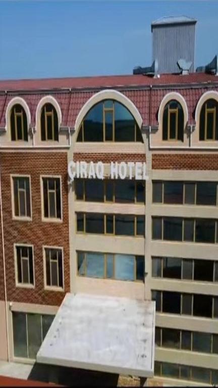 a hotel with a sign on the side of a building at Cirag Hotel Kurdemir in Kyurdamir
