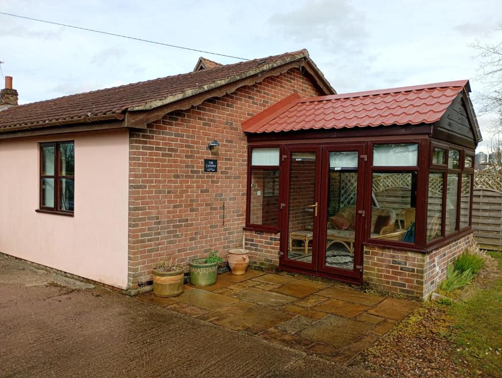 a small house with a red roof at The Catkins, Grove flock farm in Diss