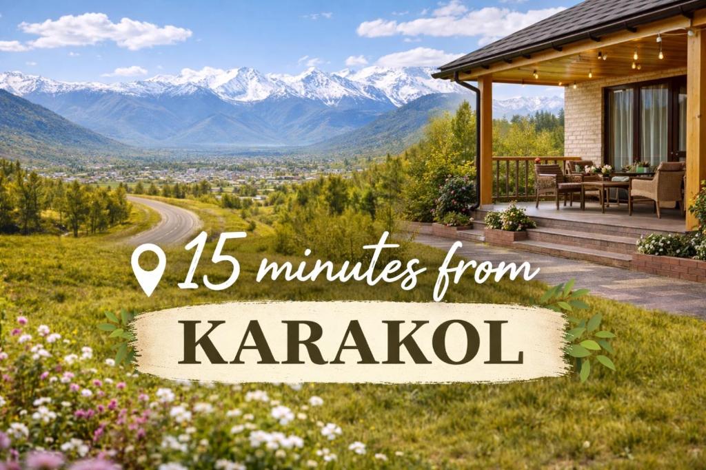 a house with a view of the mountains at Karakol Aksuu guest house in Teploklyuchinskoye