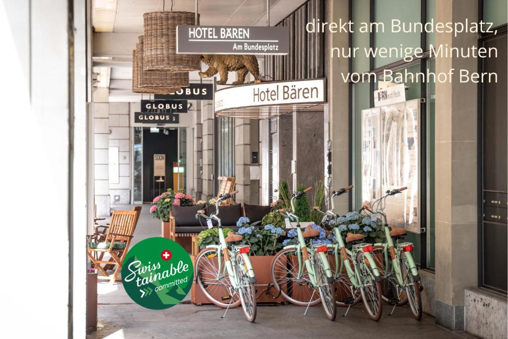 a row of bikes parked in front of a store at Hotel Bären am Bundesplatz in Bern
