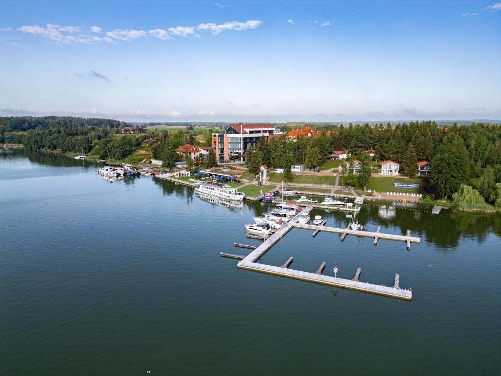 an aerial view of a marina with boats in the water at Hotel Robert's Port in Mikołajki