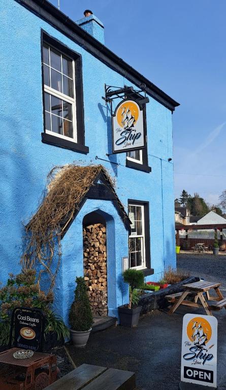 a blue building with a sign on the side of it at The Ship Inn in Bardsea