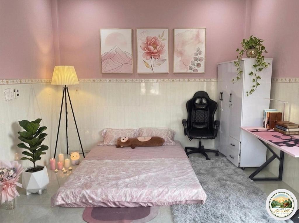 a bedroom with a bed with a teddy bear on it at Ánh Dương Local Mini Tour in An Lợi (4)