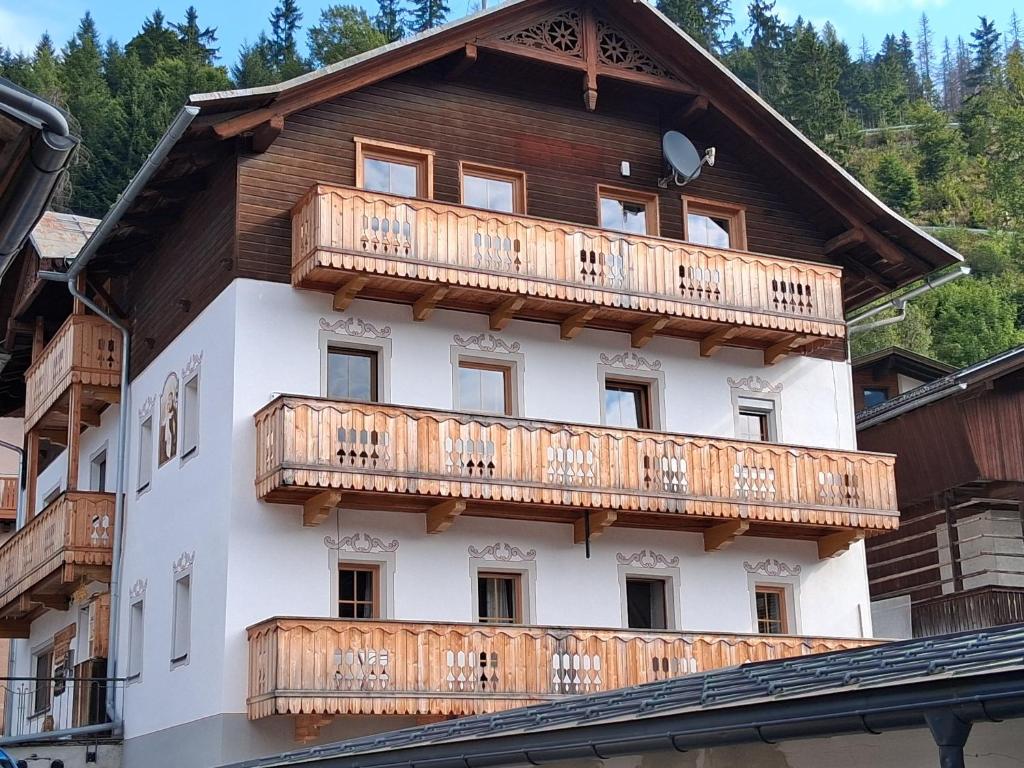 a building with wooden balconies on the side of it at Ferienwohnungen Lexahaus in Liesing