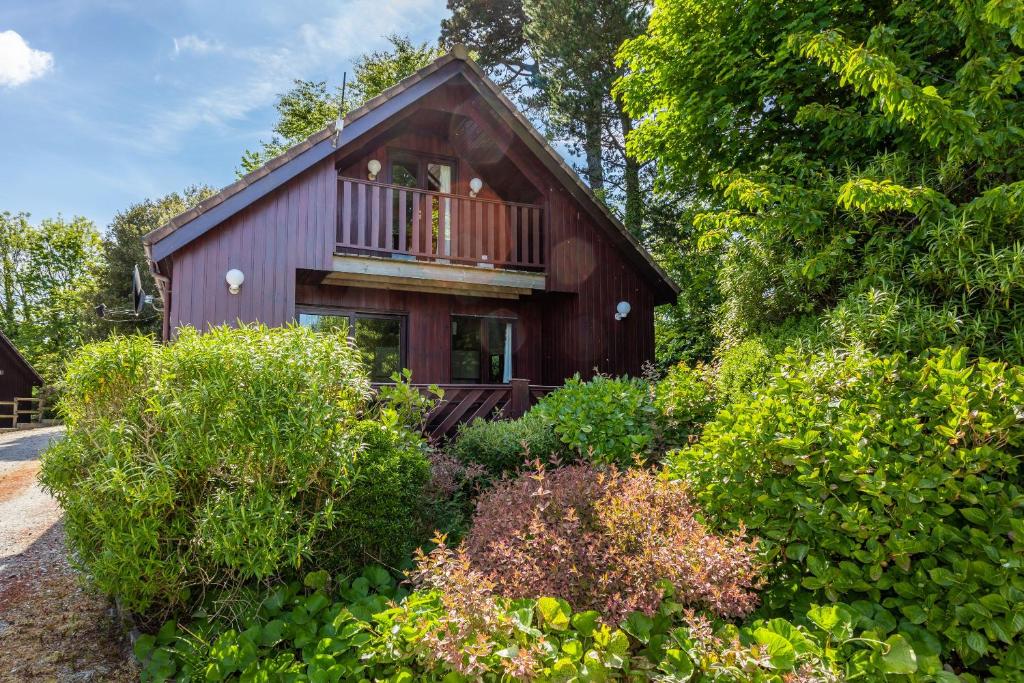 a house with a balcony on the side of it at E42 - Nare in Truro