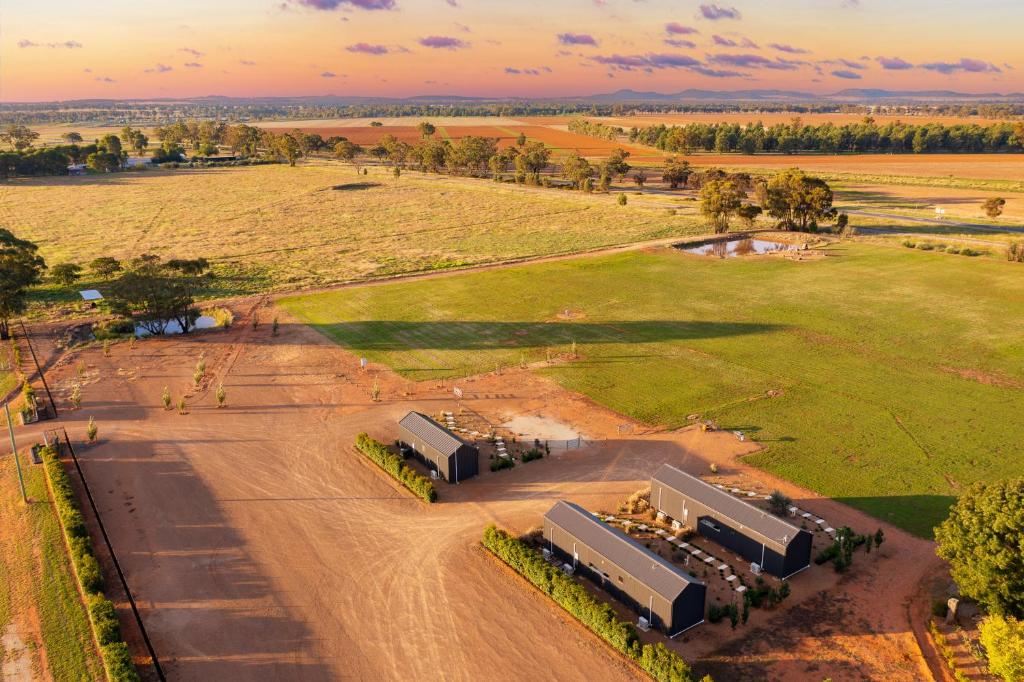 an aerial view of a field and a building at Three Ponds Estate in Temora