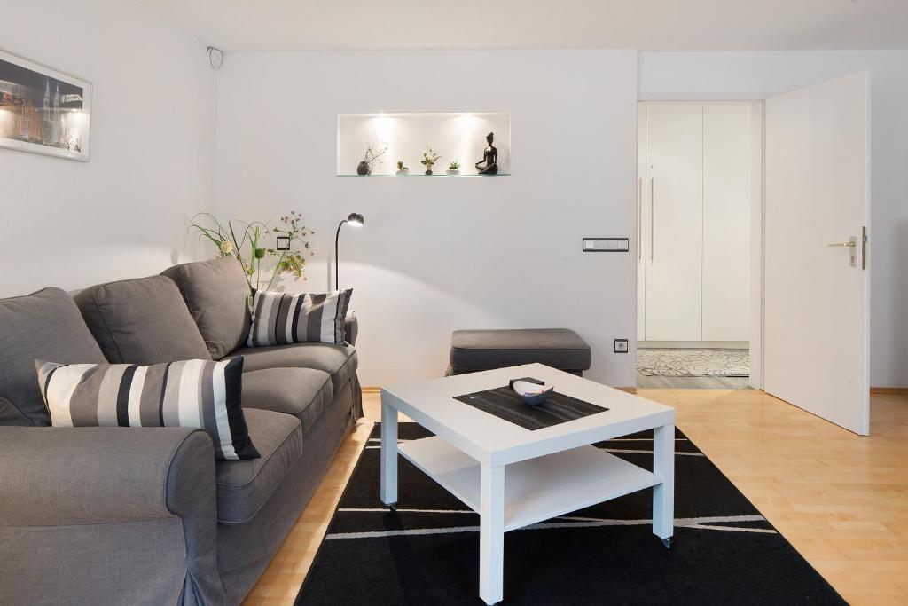 a living room with a couch and a table at Fewo Bella in Stegen
