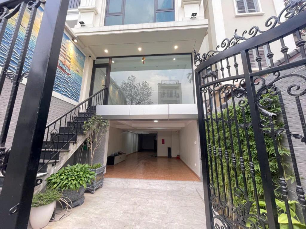 an entrance to a building with a wrought iron gate at CH home apartment in Hanoi