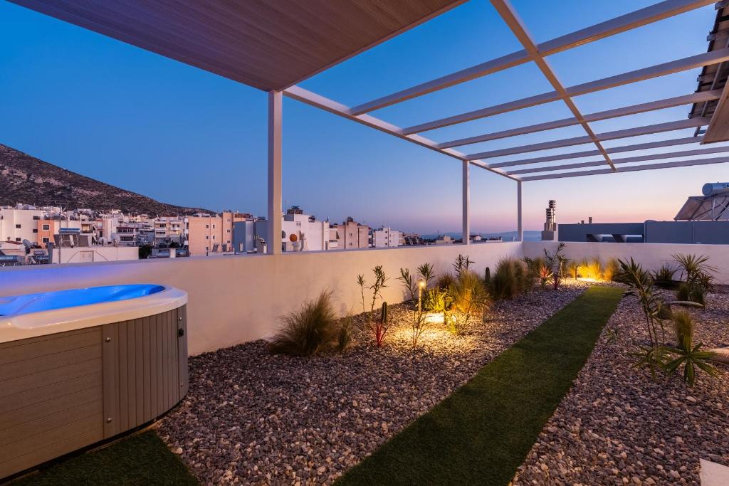a view of a backyard with a hot tub at Ether Rooftop Spa in Glyfada C47 in Athens
