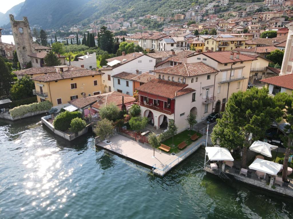 an aerial view of a town on the water at Historic house by the lake La Renée Casa Vacanza in Predore