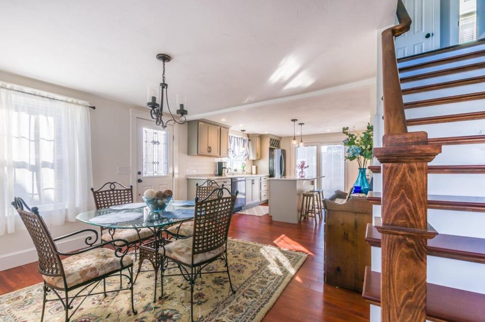 a dining room and kitchen with a table and chairs at Cape Cod Home—Deck, Near Canal Bike Path in Sandwich