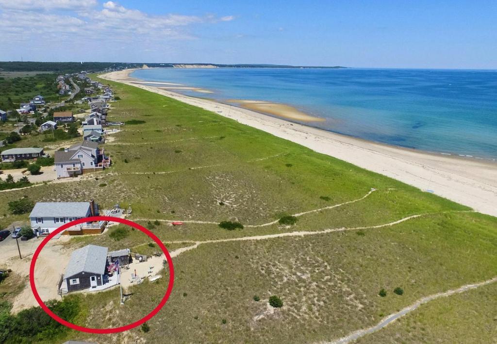 an aerial view of a house on the beach at Sagamore Beachfront Cottage Escape in Sagamore Beach