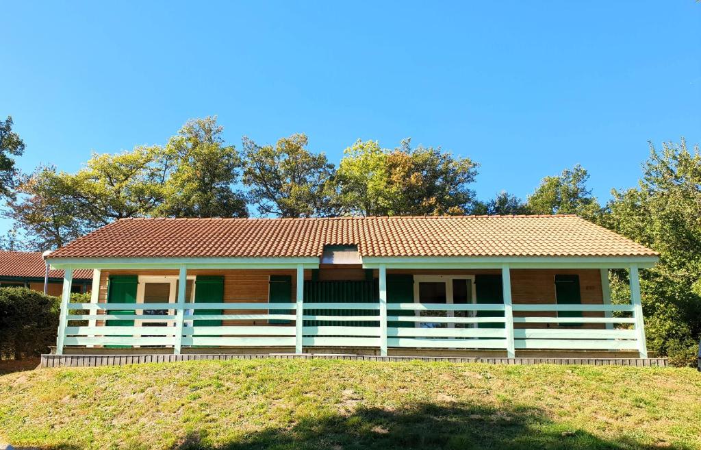 a house on a hill with trees in the background at Chalet Aster 1 in Blavignac