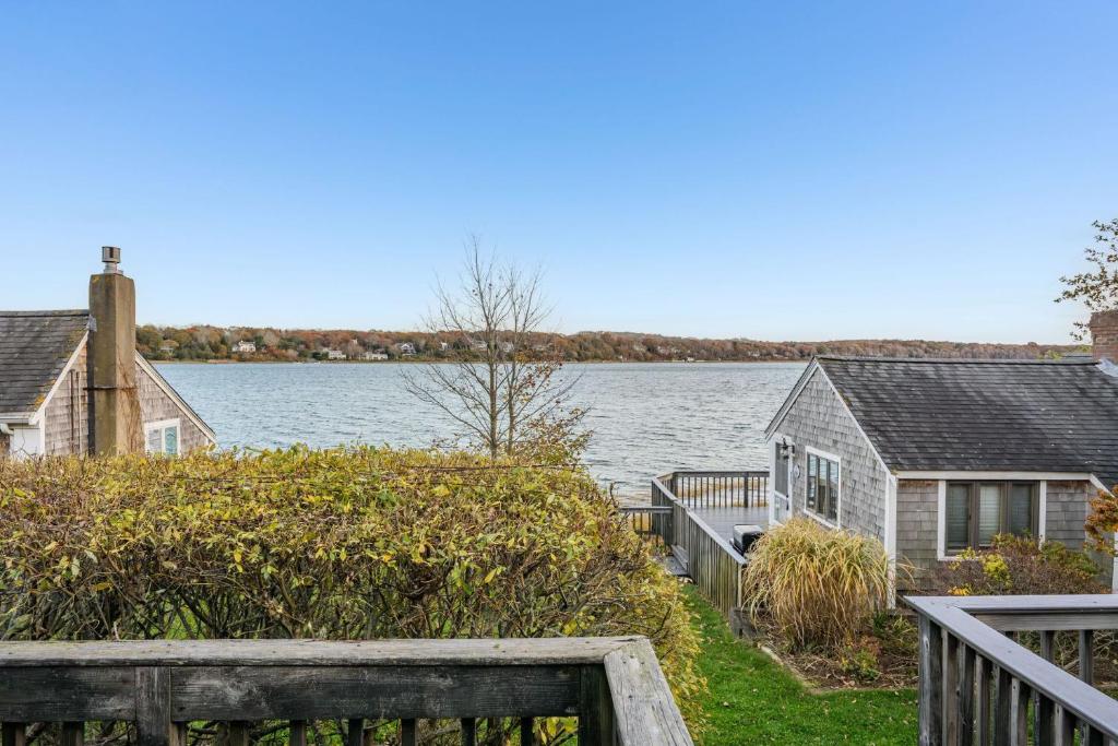 a house on the shore of a body of water at Peaceful Waterfront Cottage Escape in Eastham