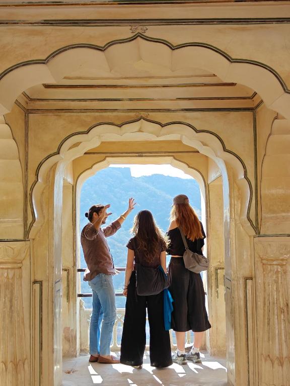 a group of people standing in an archway at Joey's Hostel Jaipur in Jaipur