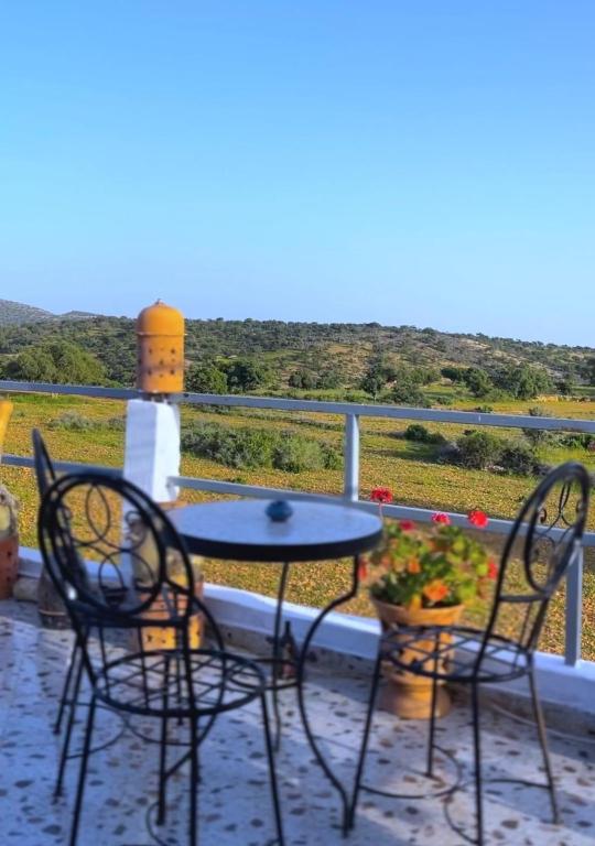 a table and chairs on a balcony with a view at Yamna home in Agadir