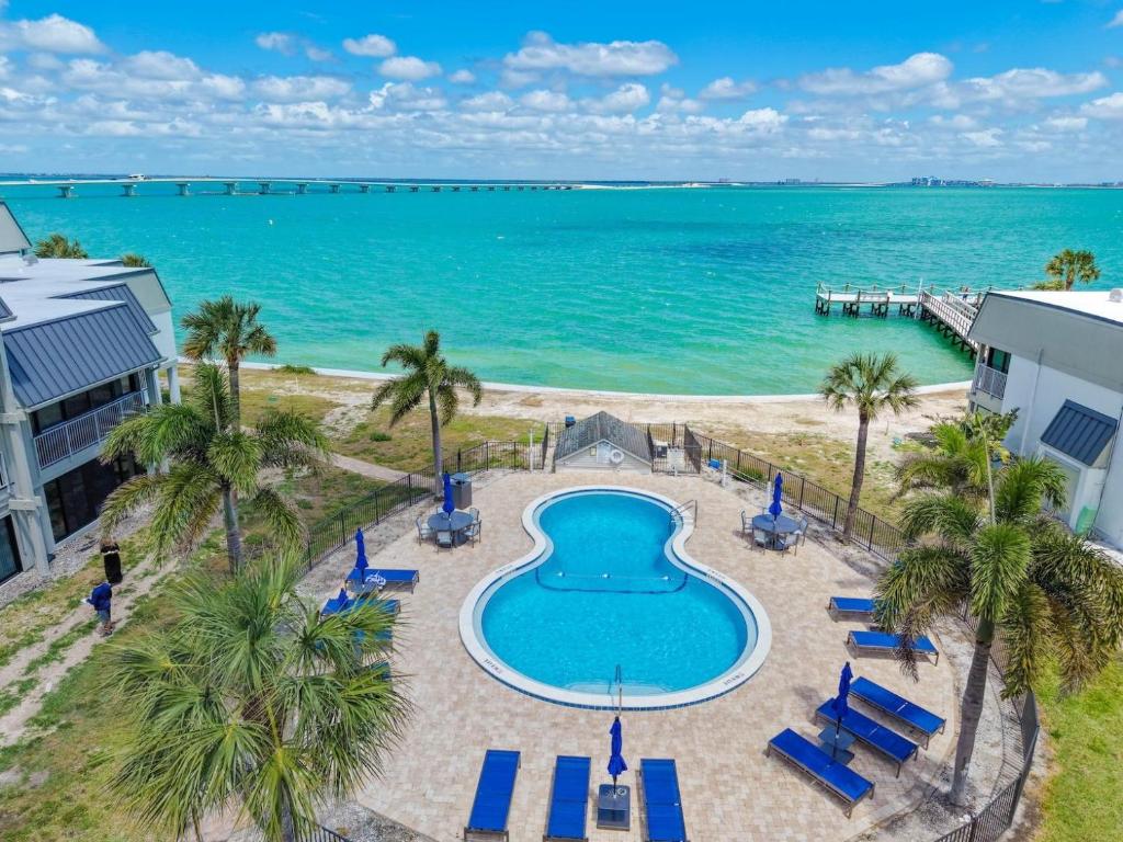an aerial view of a swimming pool and the ocean at Mariner Pointe #521 in Sanibel