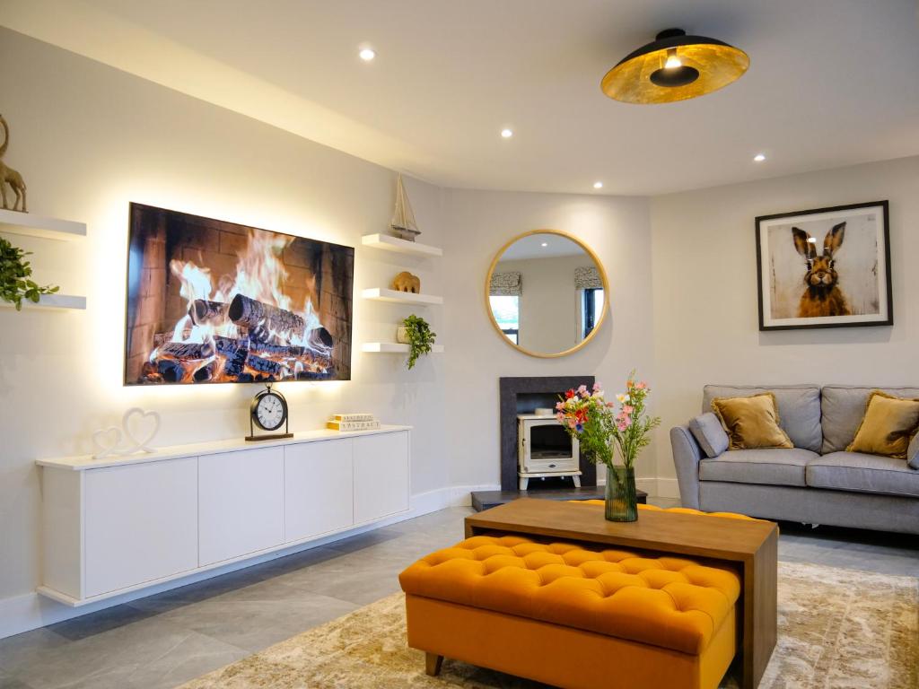 a living room with a couch and a table at Dingle Doorstep - Town Centre in Dingle