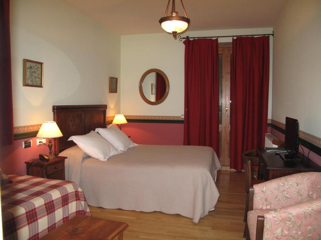 Postel nebo postele na pokoji v ubytování Hotel Casa Anita
