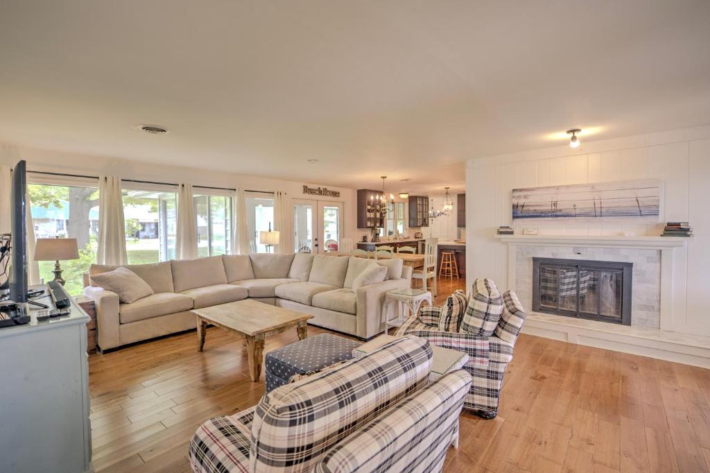 a living room with a couch and a fireplace at Lake Views & Fire Pit in South Haven