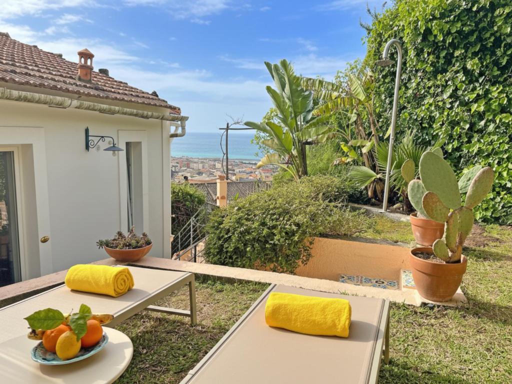 a table with a plate of fruit on it at Villa Ipomea - Cielo Suite in Salerno