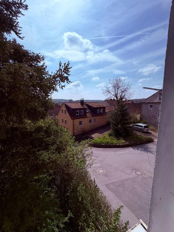 an aerial view of a house with a parking lot at Gästehaus Nachtigall in Gädheim