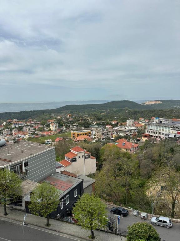 a view of a city with buildings and cars at Kruja Grande Hotel in Krujë