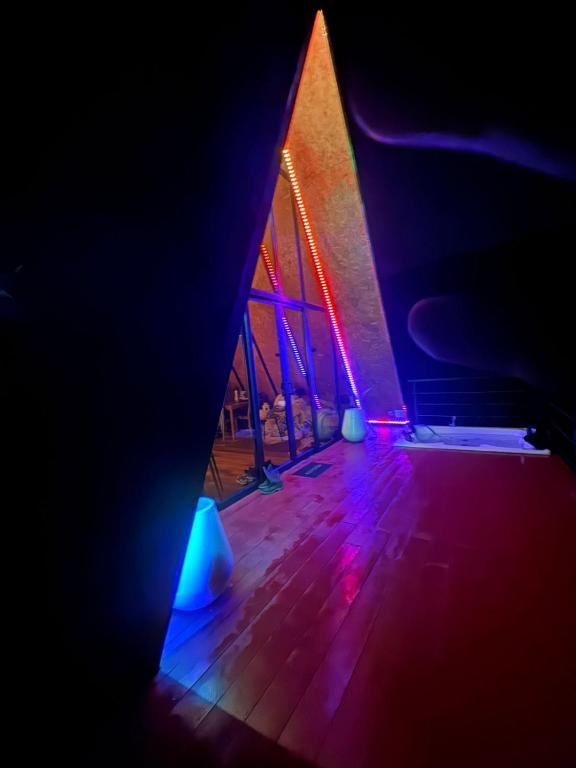 a room with purple and blue lights on the floor at Cabaña Nivura in Palmira