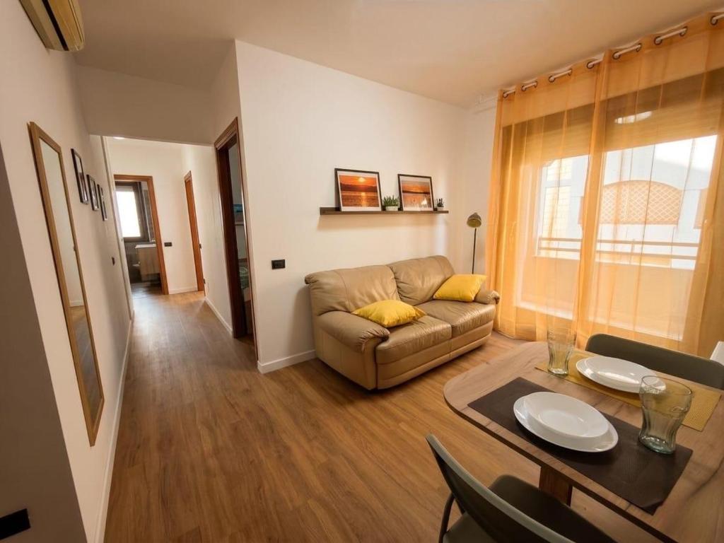 a living room with a couch and a table at Casa Cesare in Cagliari