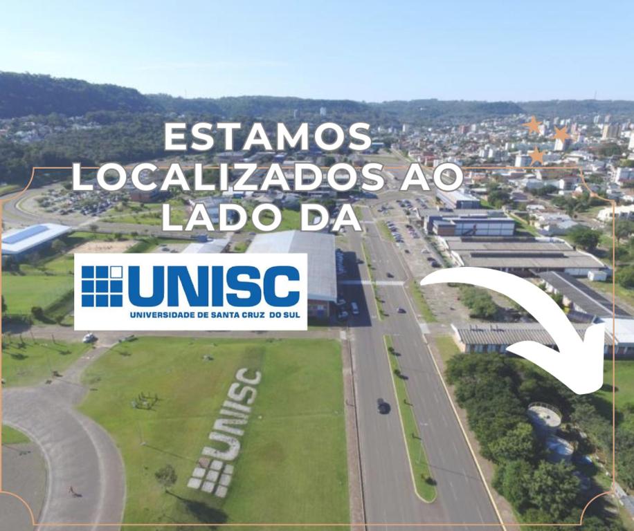 a view of a city with the words essamines localals associations nalde da at next to UNISC in Santa Cruz do Sul