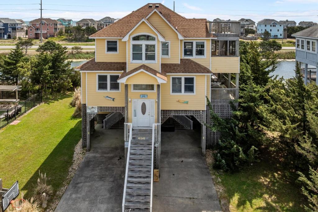 a house with a staircase leading up to the front door at 7680 - Sandy Bottom in Avon